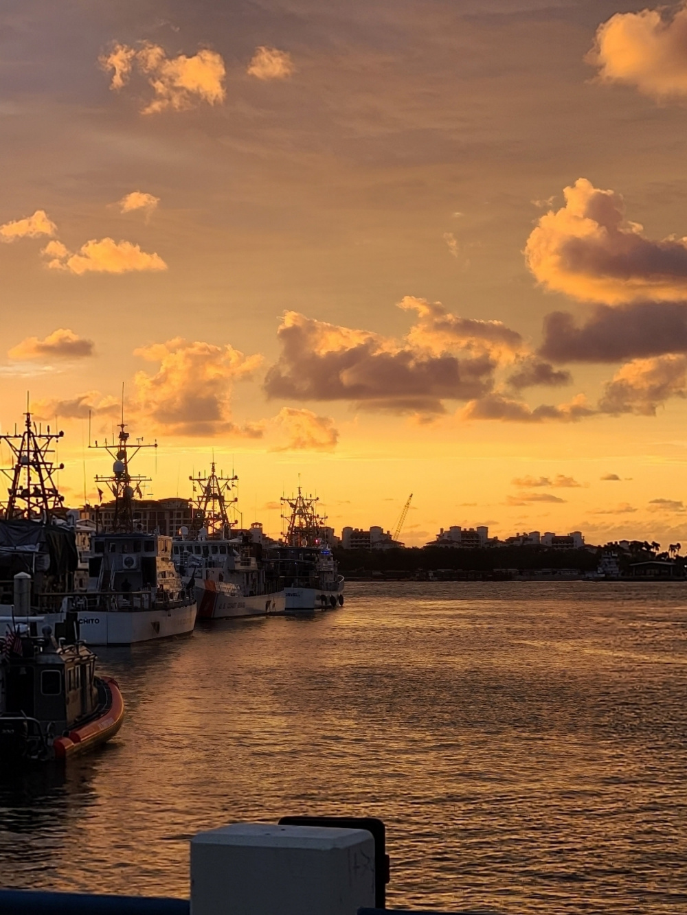 Coast Guard crews prepare for the day at sunrise at Base Miami Beach and Sector Miami as the cutters and small boats are moored Dec. 4, 2020. (U.S. Coast Guard photo by Chief Petty Officer Victor Cruz)