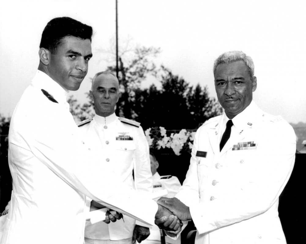 Cmdr. Merle J. Smith, Jr. was the second African American to receive an appointment to the Coast Guard Academy and the first to graduate. Smith Jr., pictured with his father, U.S. Army Col. Merle J. Smith, Sr., and Adm. Willard J. Smith, Coast Guard Commandant at Commencement in 1966 at the Coast Guard Academy. (U.S. Coast Guard courtesy photo)