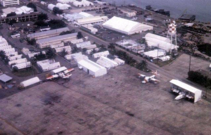 Aerial view of Coast Guard air station detachment Sangley Point showing the unique open-air nose dock sheds for aircraft maintenance. (Wikimedia Commons)