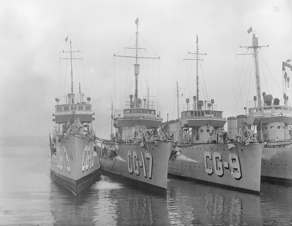 One of the first warships operated by the Coast Guard, Destroyer Paulding (CG-17), is located in the middle of nested Prohibition-era destroyers operated by the service. (U.S. Coast Guard)