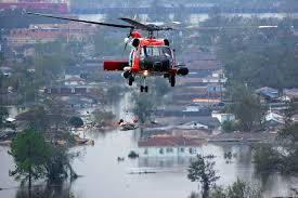 Photo of a Coast Guard helicopter operating in the challenging flying conditions of New Orleans after Hurricane Katrina. (U.S. Coast Guard)