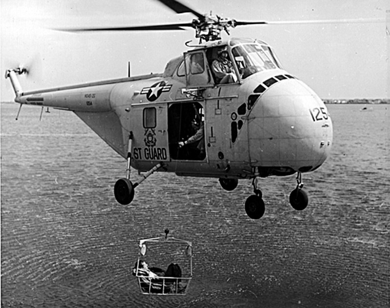 5.	Photo of a Coast Guard HO4S-3G helicopter showing its rescue hoist capability and enclosed cabin area below the cockpit. (Coast Guard Aviation Association)