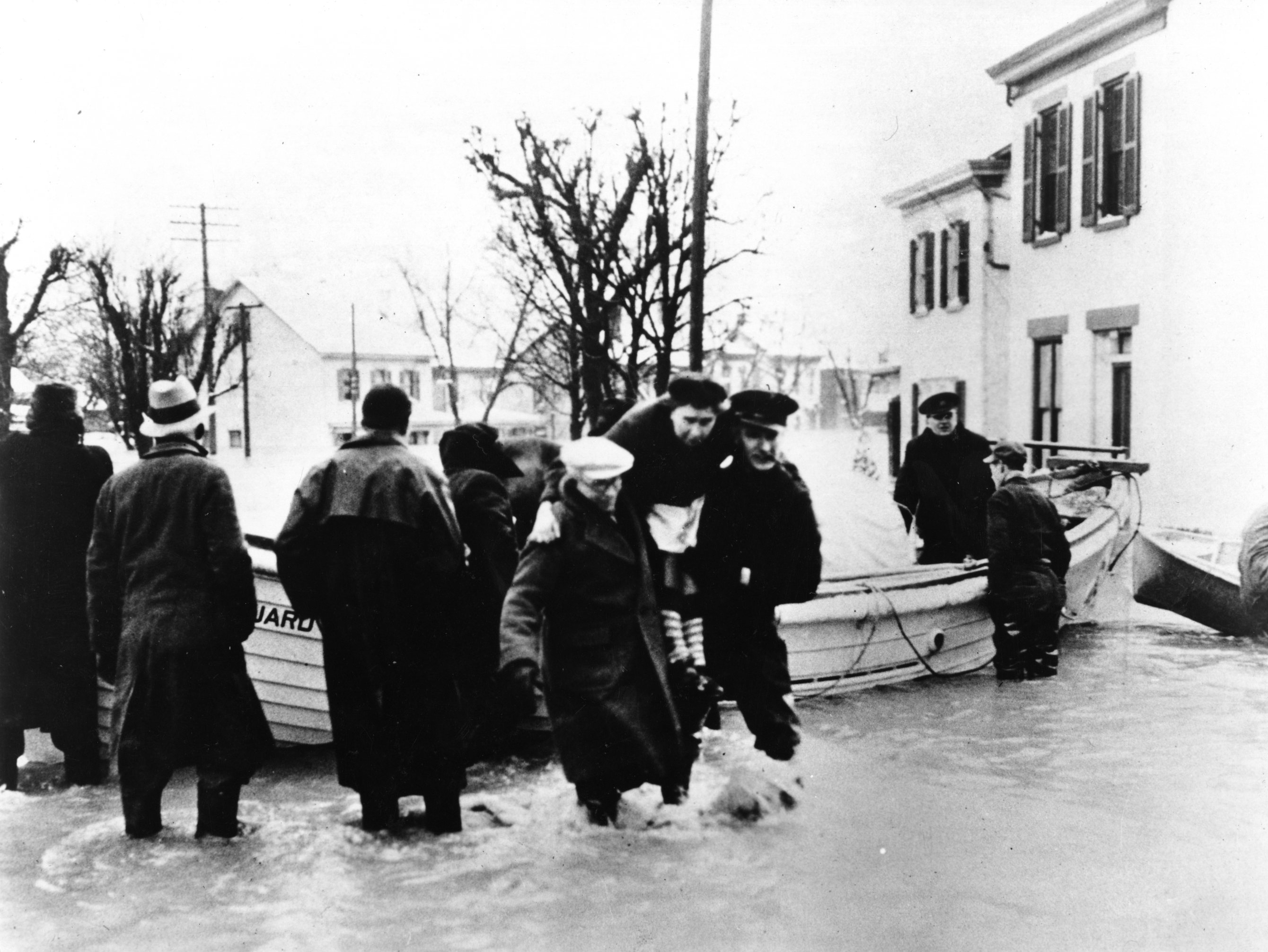 Coast Guardsmen rescuing survivors from flooded homes in Lawrenceburg, Ohio. (U.S. Coast Guard)