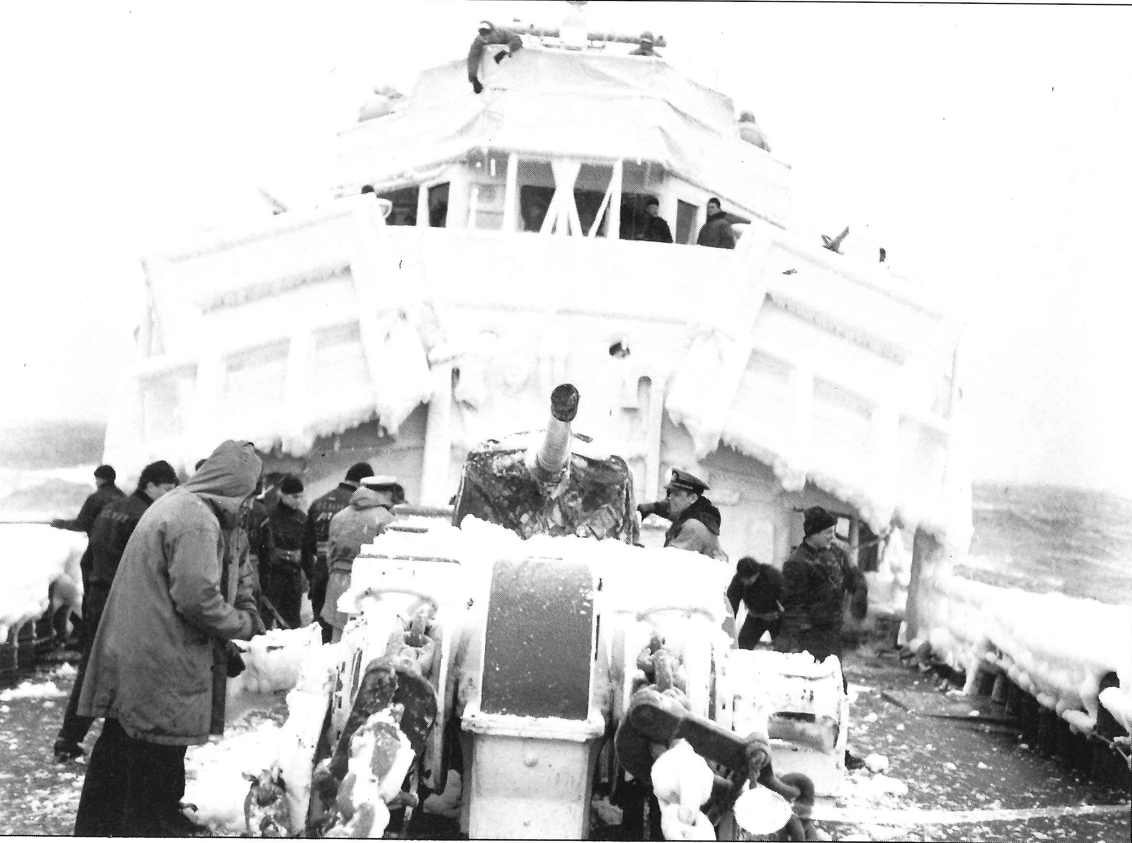 7.	Northland’s crew chipping ice. If allowed to accumulate the ice could make ships dangerously top-heavy. (U.S. Coast Guard)