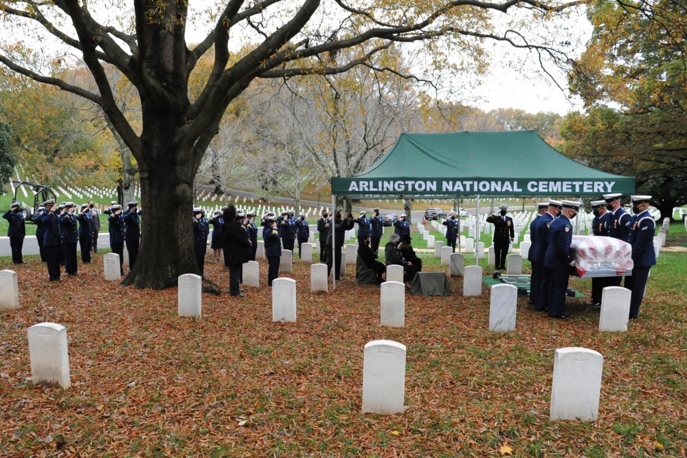 U.S. Coast Guard members in attendance of Capt. Eleanor L'Ecuyer's burial at Arlington National Cemetery, Virginia, salute as her remains are brought to her final resting place, Nov. 12, 2020. Approximately 70 Coast Guard members were in attendance. (U.S. Coast Guard Photo by Petty Officer 2nd Class Brian McCrum)