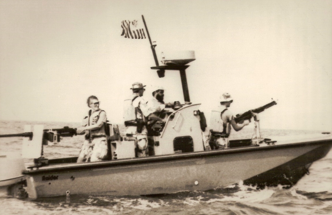 10.	A Port Security Unit Raider boat during the First Gulf War with female reservist Sandy Mitten manning the aft .50 caliber machine gun.