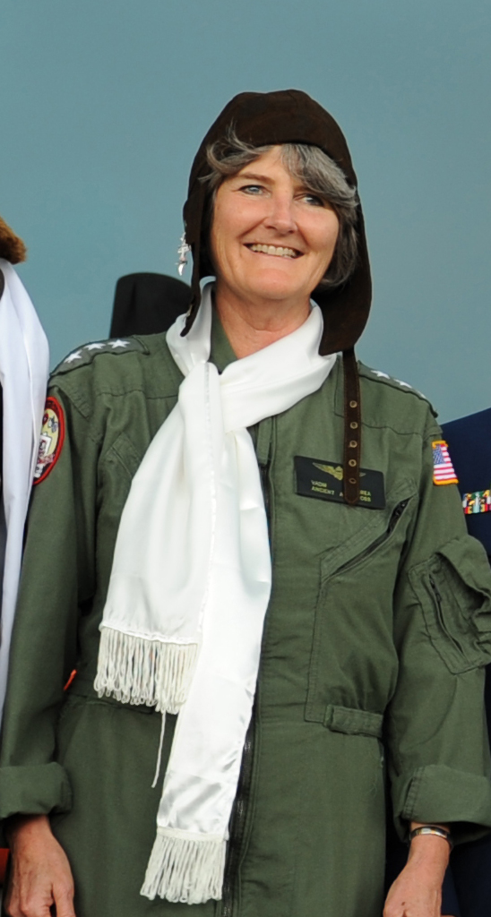 10.	Candid photograph of Vice Adm. Vivien Crea wearing the garb of the Ancient Albatross, the longest serving aviation officer in the service. (U.S. Coast Guard)