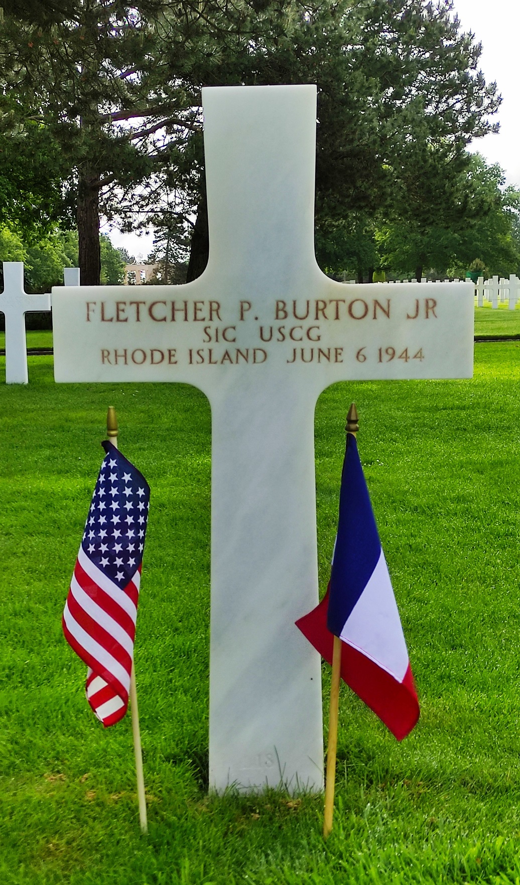 Seaman First Class Fletcher Burton’s headstone located at the Normandy American Cemetery at Colleville-sur-Mer, France. (American Battle Monuments Commission, Emmanuelle Hotier)