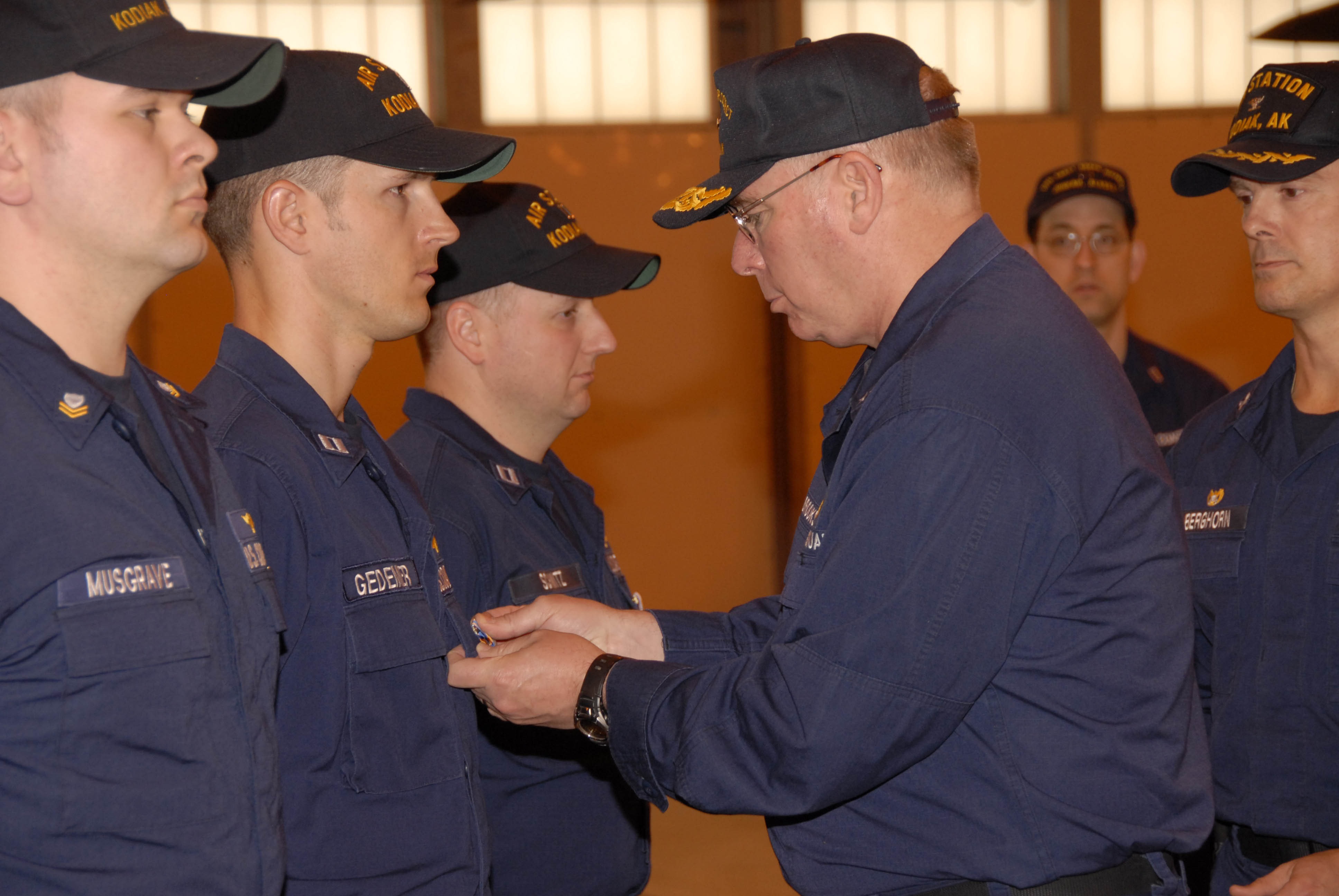 Members of Munro’s HH-65 aircrew receive the Air Medal from Coast Guard District Seventeen commander Rear Adm. Gene Brooks at a special ceremony Air Station Kodiak. Pictured are Lt. Greg Gedemer, Lt. T.J. Schmitz and Petty Officer 2nd Class Al Musgrave. (Petty Officer 1st Class Kurt Fredrickson, U.S. Coast Guard)