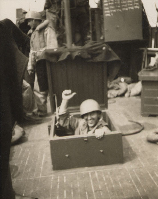 A jubilant CG-16 crewmember points to headcount of Allied service members saved on D-Day. (Courtesy of Hannigan family)