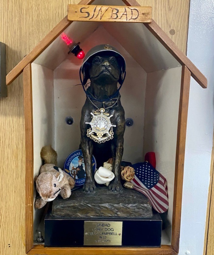 14.	Statue on board today’s medium-endurance cutter Campbell honoring the service of Chief Canine Sinbad for years of distinguished service. (U.S. Coast Guard)