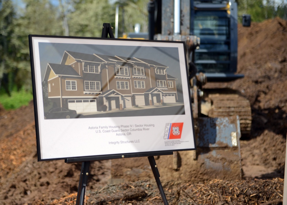 Designs for the homes of future Coast Guard members are displayed at a construction site groundbreaking ceremony held at the Coast Guard housing neighborhood in Astoria, Ore., April 6, 2015. The construction will add 12 additional units to the 120 already housing Coast Guard members in the neighborhood. (U.S. Coast Guard photo by Petty Officer 3rd Class Jonathan Klingenberg)