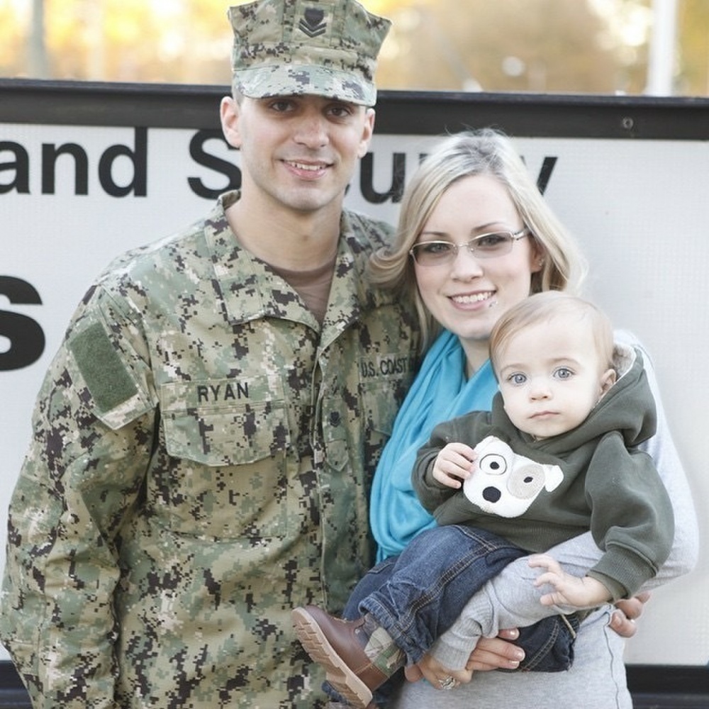 Coast Guard Reserve Petty Officer 2nd Class Sean P. Ryan poses for a photo with his wife and son in Yorktown, Va. (U.S. Coast Guard photo)