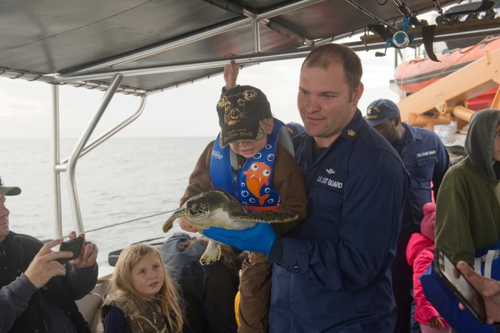 The crew of Coast Guard Cutter Cushing out of Atlantic Beach, N. C., helps release 27 rehabilitated sea turtles into Gulf Stream waters, Saturday, Jan. 21, 2017. The sea turtles were rescued by North Carolina Aquarium crews after experiencing cold water shock earlier this winter. (U.S. Coast Guard photo by Auxiliarist Trey Clifton)