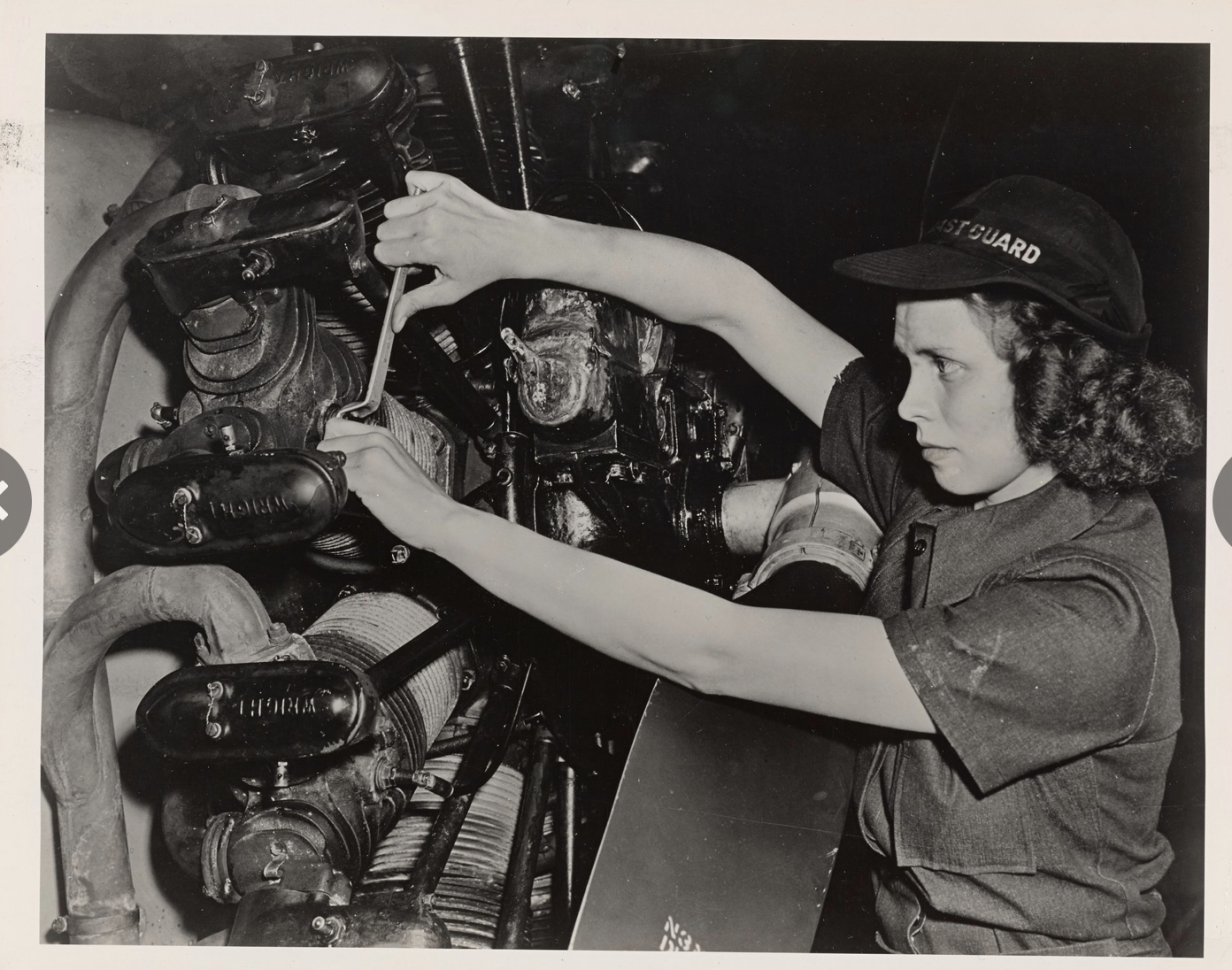 SPAR aviation mechanic Evelyn Doell working on the radial engine of a Coast Guard fixed-wing aircraft during World War II. (National Archives)