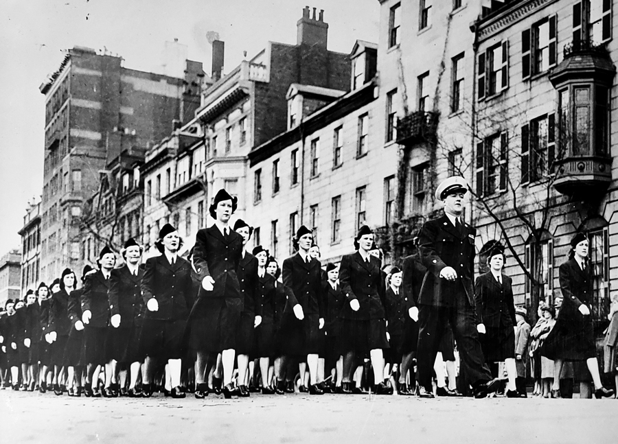 Temporary reserve women marching in formation in a parade and wearing official TR uniforms. (Dot Slamin Collection at the Waltham Historical Society)