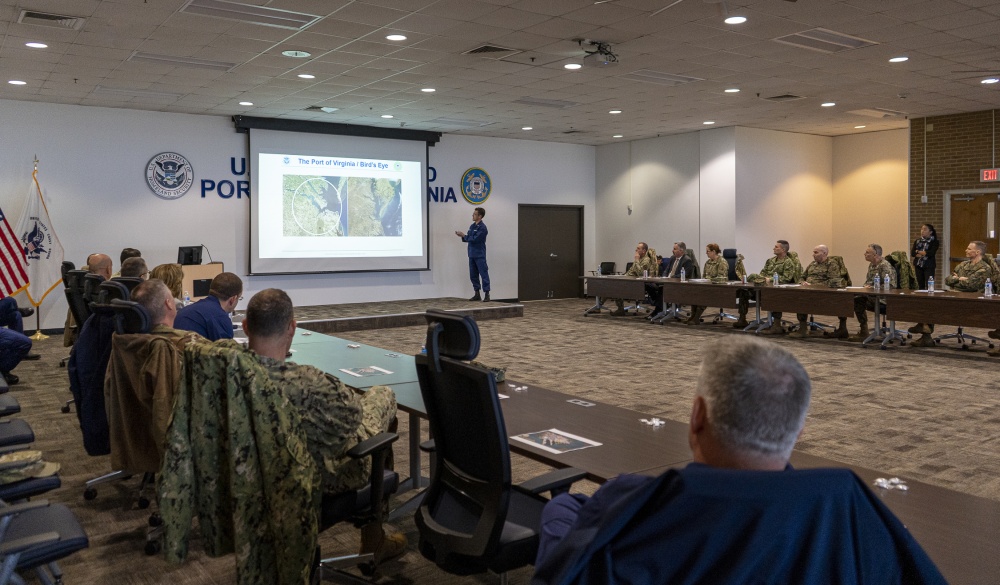 Coast Guard Capt. Samson Stevens shows an aerial view of the Port of Virginia during the Cyber Component Commanders’ Conference aboard Coast Guard Base Portsmouth, Virginia, March 6, 2020. The aerial view served to show just how small the region is, and stressed the importance of the Coast Guard maintaining strong partnerships with the Port of Virginia to protect the area from cyber attacks. (U.S. Coast Guard photo by Seaman Katlin Kilroy)