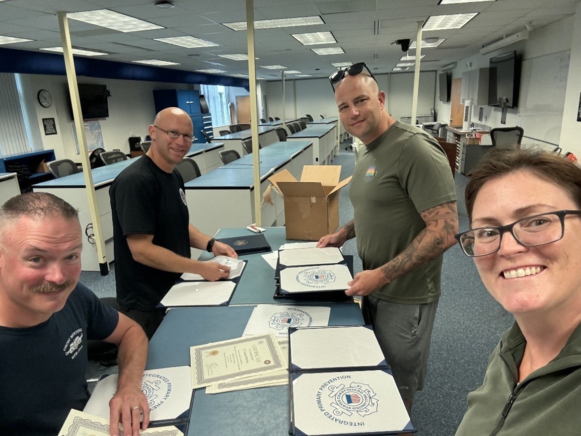 (From left to right) Resilience Coordinators Master Trainers (RCMTs) Senior Chief Petty Officer Joe Zrelak, Petty Officer First Class Joseph Glaser-Reich, Master Chief Petty Officer Matt Rogers, and Cmdr. Merridith R. Morrison (U.S. Coast Guard photo courtesy of the Integrated Primary Prevention Program). (From left to right) Resilience Coordinators Master Trainers (RCMTs) Senior Chief Petty Officer Joe Zrelak, Petty Officer First Class Joseph Glaser-Reich, Master Chief Petty Officer Matt Rogers, and Cmdr. Merridith R. Morrison (U.S. Coast Guard photo courtesy of the Integrated Primary Prevention Program).