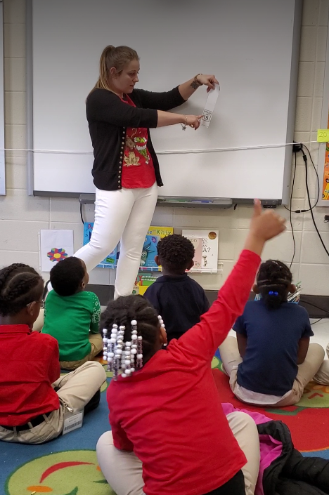 Chelsea Hughes teaches a lesson to her first-grade class at W.D. Robbins Elementary school in Alabama, in Dec. 2019. (USCG photo)
