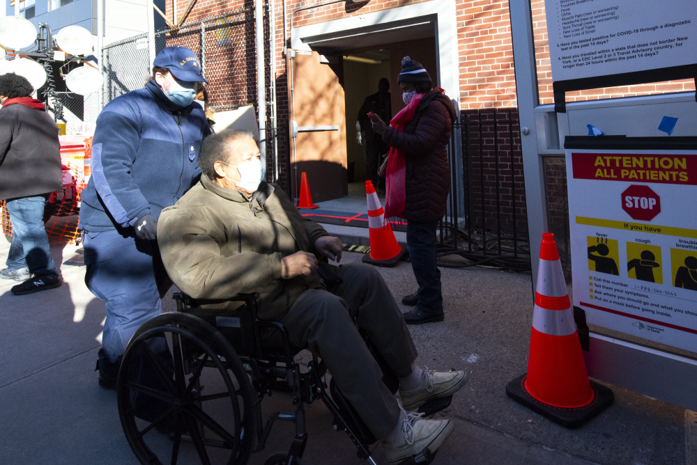 Petty Officer 2nd Class Kristin Matuska, a reservist machinery technician at Coast Guard Station New York, assists residents at a FEMA COVID-19 vaccination site in Brooklyn, New York, March 2, 2021. Coast Guard reservists have been deployed to assist with Community Vaccination Center operations organized by FEMA, U.S. Department of Health and Human Services, and state, local, tribal and territorial partners, to support national goals for COVID-19 health and safety and vaccine distribution. (Coast Guard photo by Petty Officer 2nd Class Cory J. Mendenhall)