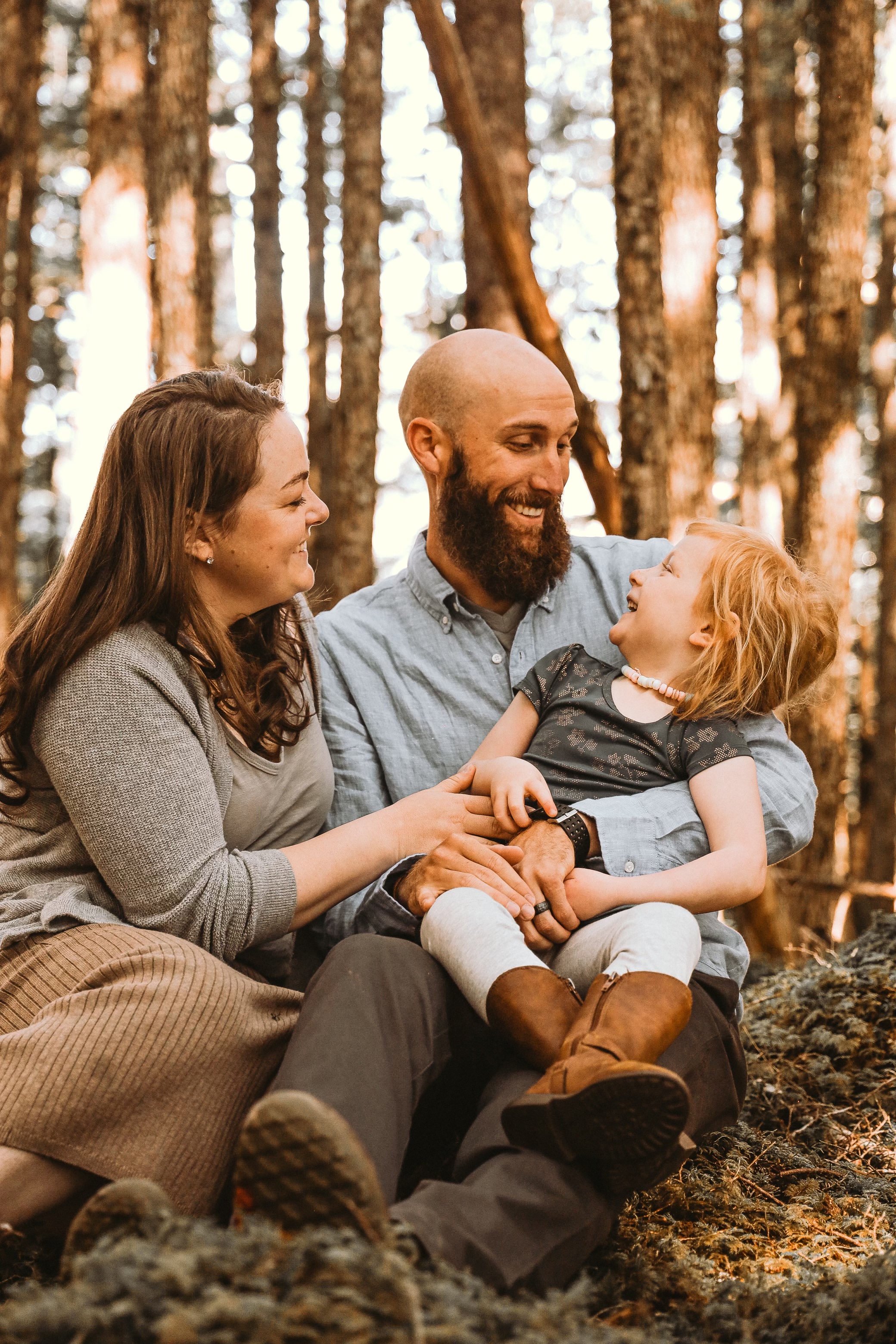 Coast Guard spouse, Cody Wagner (left) is shown with his wife, Petty Officer 2nd Class, Mary McLenagan, a machinery technician and their daughter Bridget Wagner.