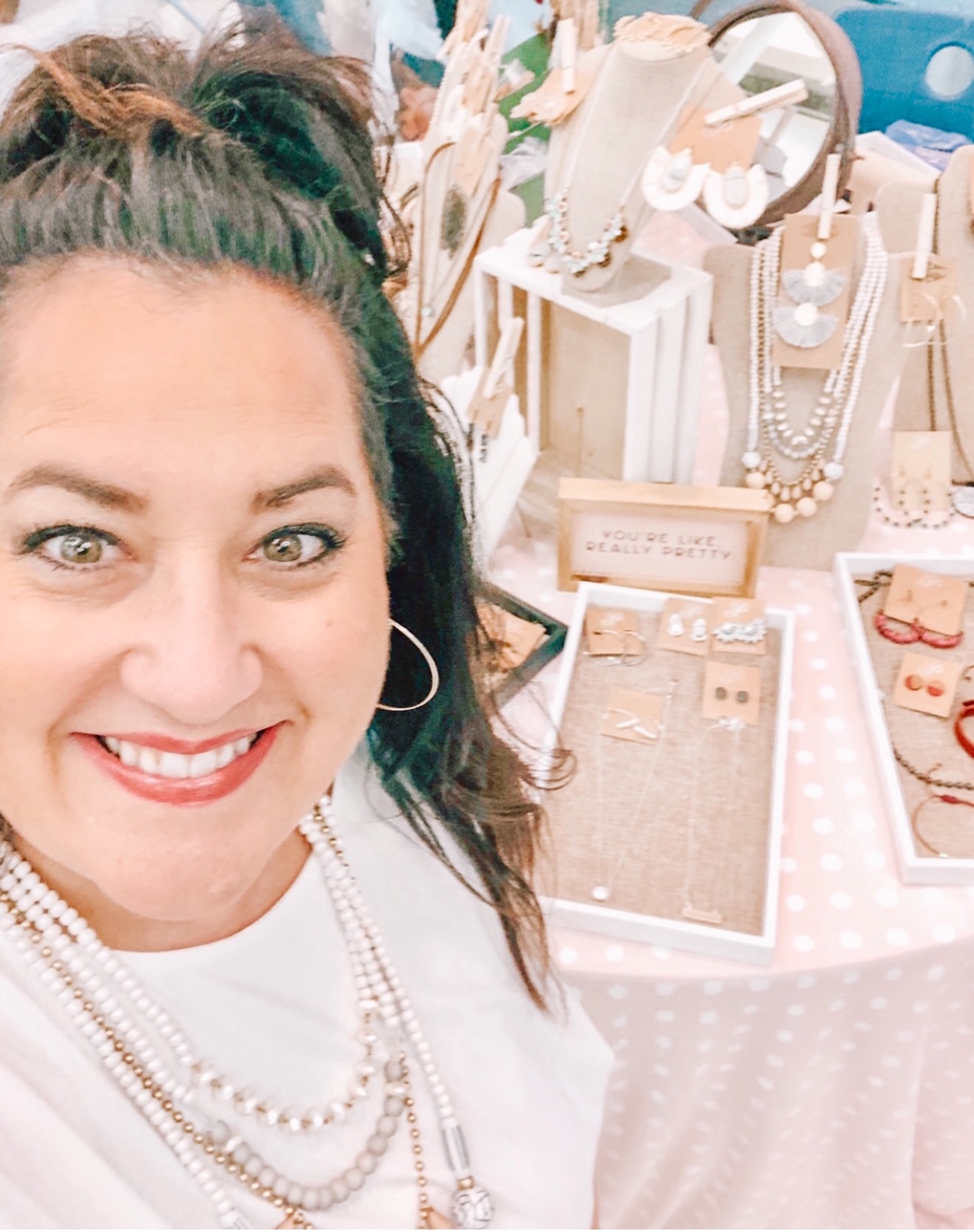 Paulette Fryar wearS pieces of her jewelry from her business as an independent distributor. Fyar has been in the business for four years and has been able to continue working as she has relocated throughout the country with her spouse.