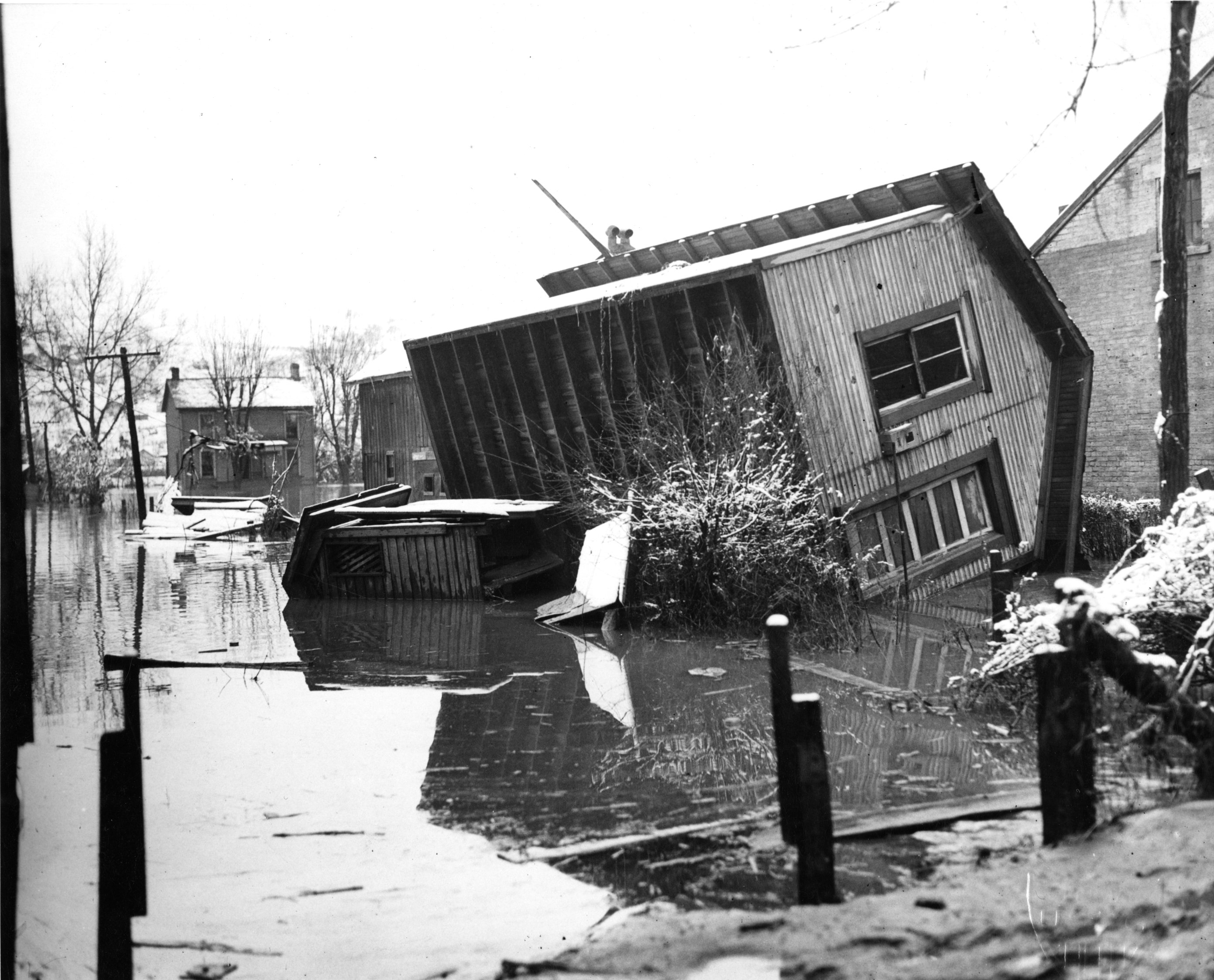 2.	Floodwaters float a house off its foundation in Powhatan, Ohio, Jan. 1937. (U.S. Coast Guard)