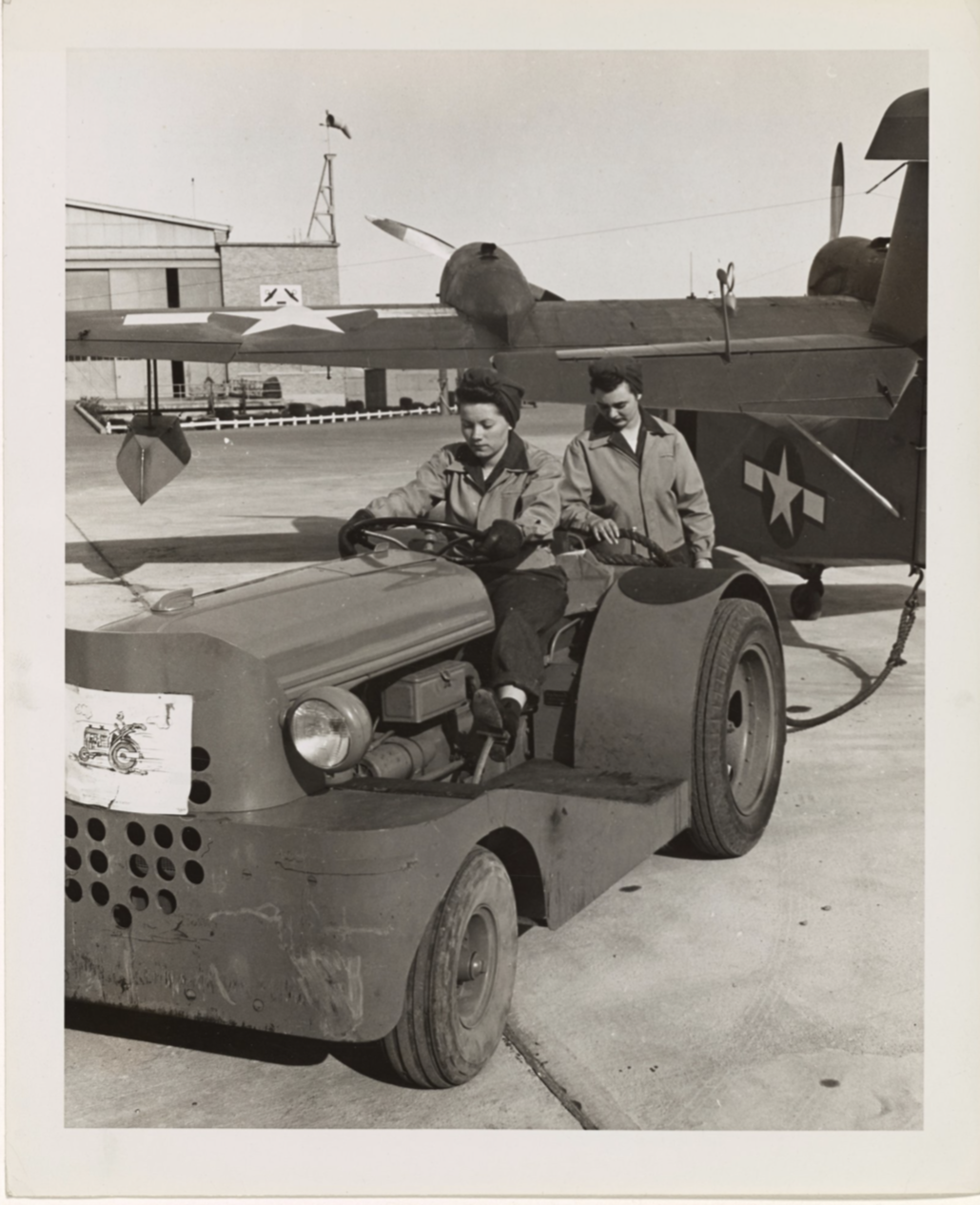 SPAR aviation mechanic Marian Behrends preparing to tow a Coast Guard amphibian aircraft back to the hangar. (National Archives) SPAR aviation mechanic Marian Behrends preparing to tow a Coast Guard amphibian aircraft back to the hangar. (National Archives)