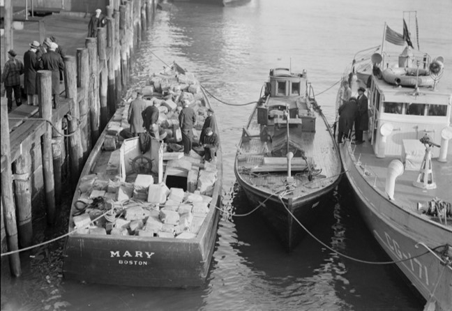 2.	A Boston rumrunner loaded with liquor after apprehension by the Coast Guard. (Boston Public Library)