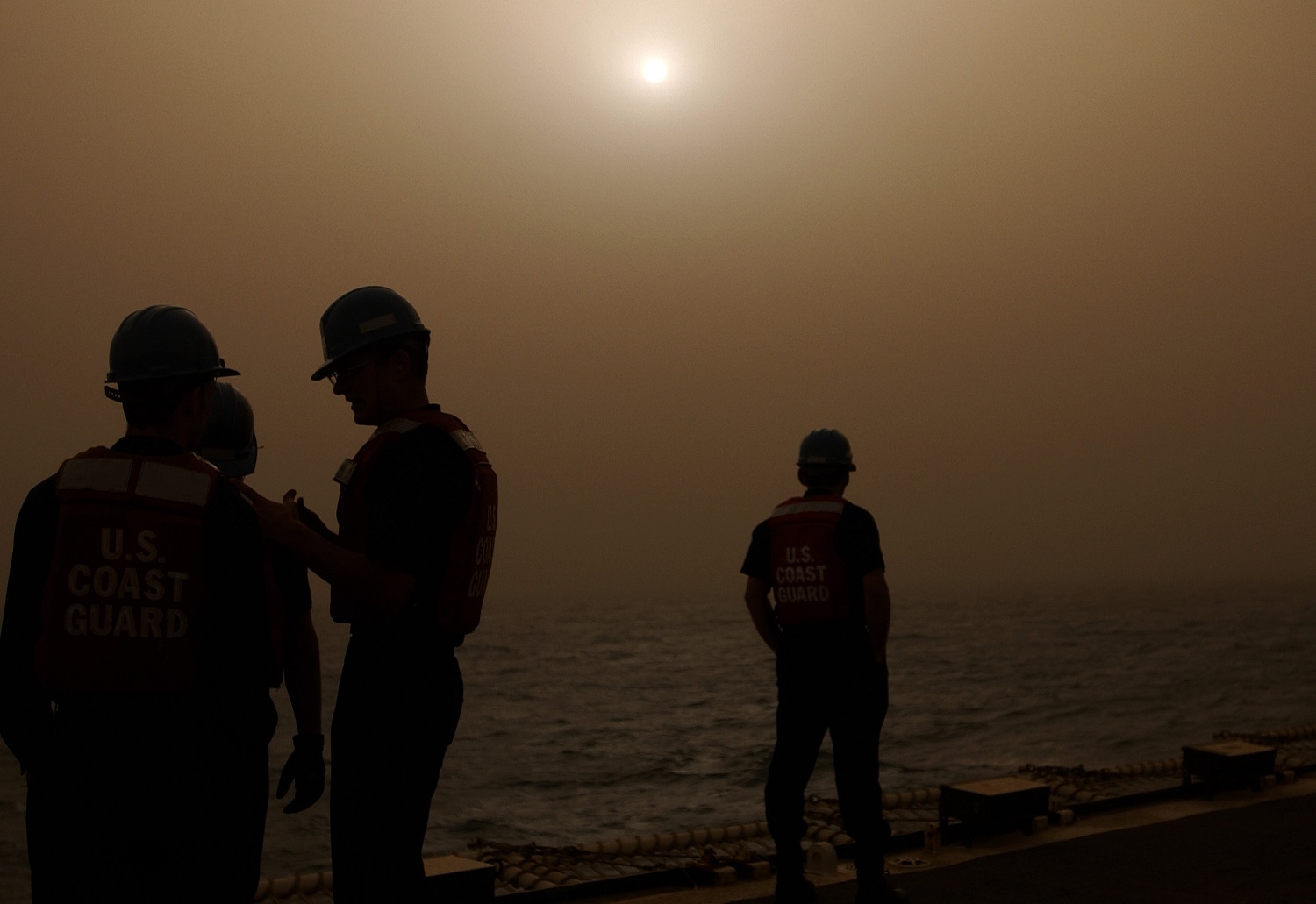Coast Guardsmen endure a sandstorm during Operation Iraqi Freedom. (U.S. Coast Guard)