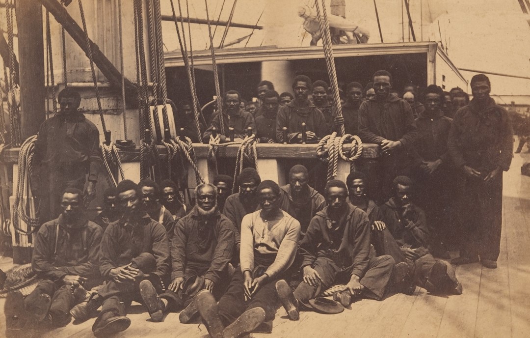 Contraband sailors on the Union Navy receiving ship USS Vermont, moored at Port Royal, South Carolina, during the Civil War. (metmuseum.org)