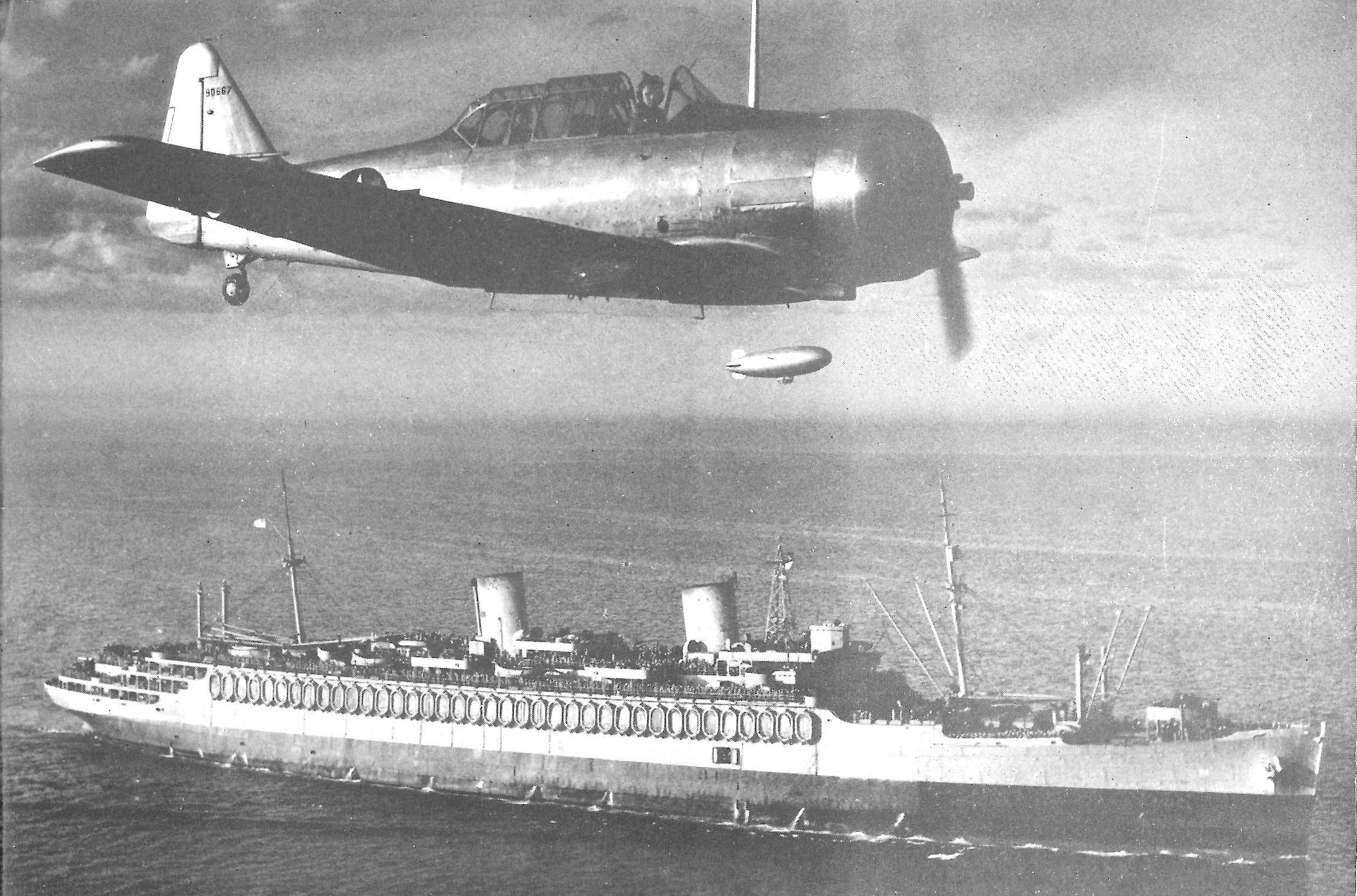 2.	Aerial photograph of Coast Guard-manned USS Wakefield steaming out of the protection of U.S. waters to deliver troops to the war zone. (U.S. Coast Guard)