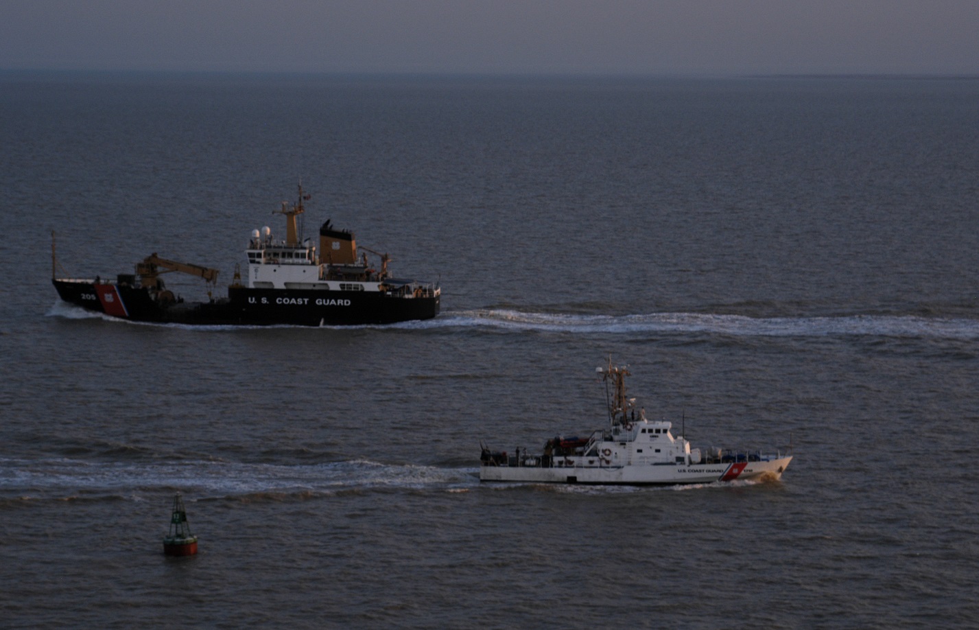 Coast Guard Cutter Walnut, a buoy tender homeported in Honolulu and deployed to the Persian Gulf in February 2003, is underway in the Persian Gulf with a patrol boat in the foreground. The cutter arrived in the Persian Gulf Feb. 27, 2003 to support U.S. Naval Forces Central Command during Operation Iraqi Freedom. (Coast Guard Collection)