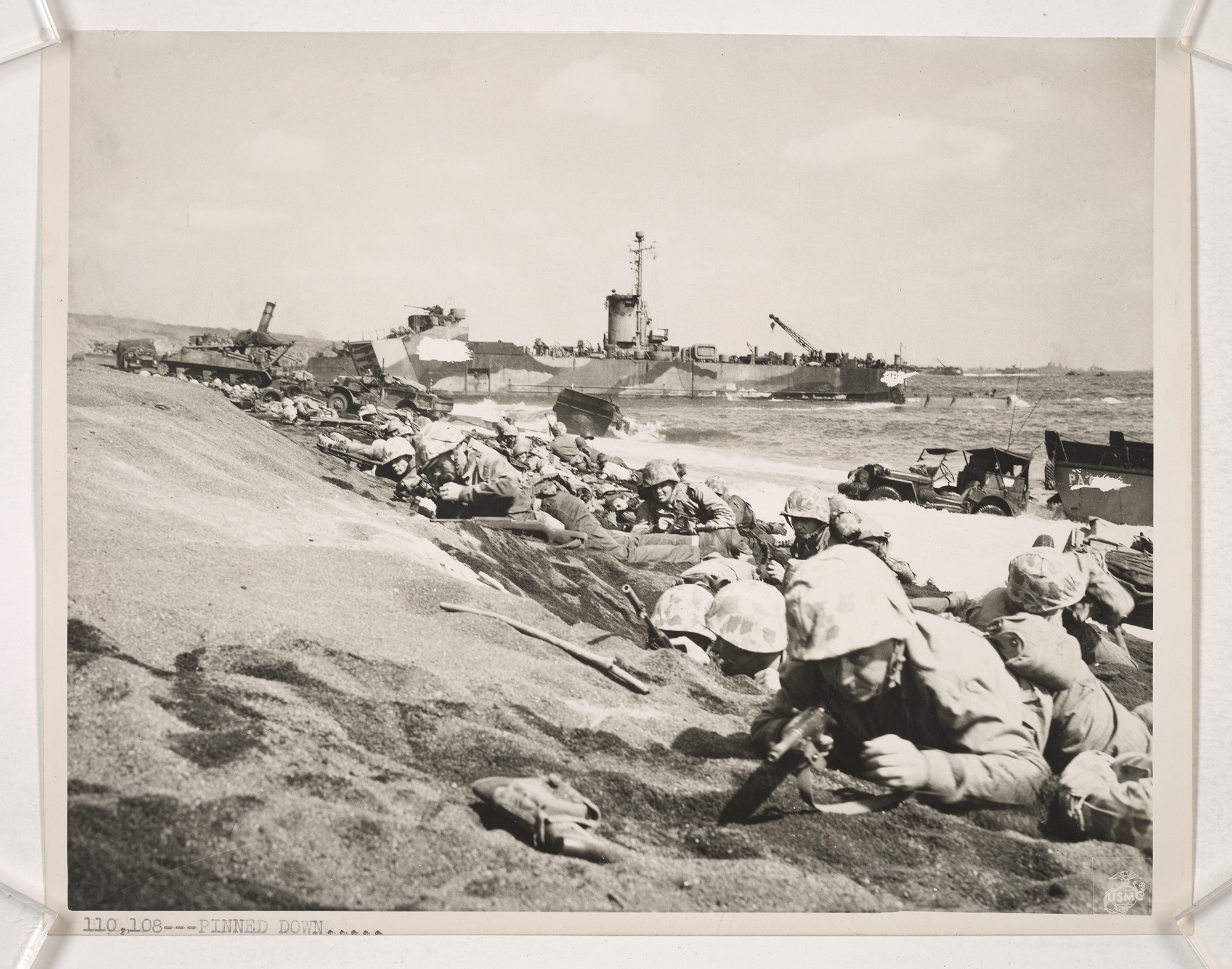 Marines pinned down by enemy fire on the landing beaches of Iwo Jima. (National Archives)