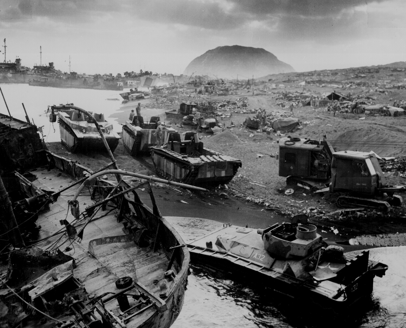 Wreckage and landing craft litter the landing beaches of Iwo Jima, where Marvin Perrett lost his LCVP in heavy surf. (National Archives Photo)