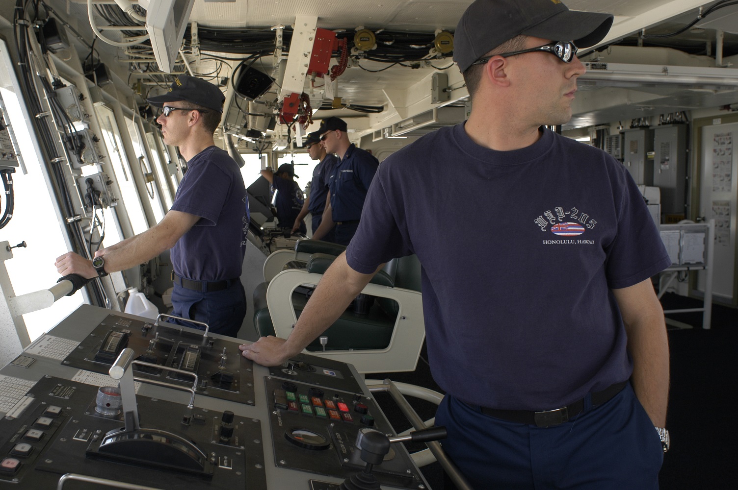 Members assigned to the Coast Guard Cutter Walnut keep watch from the bridge while underway while deployed to the Persian Gulf supporting Operation Iraqi Freedom. (Coast Guard Collection)