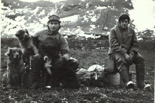 Radioman 2nd Class Jeano Campanaro with a fellow service member and the radio station’s dogs. (courtesy of Jeano Campanaro)