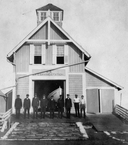  Period photograph of Station Cape Hatteras, with Keeper Patrick Etheridge standing at far left. (Courtesy of the National Archives)
