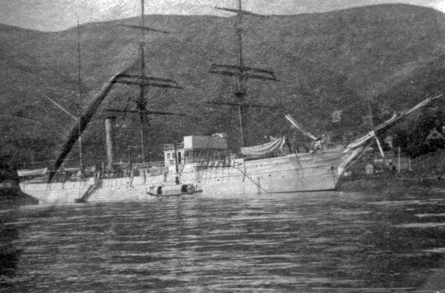 Rare photograph of Thetis at anchor in calm Hawaiian waters. (U.S. Coast Guard)