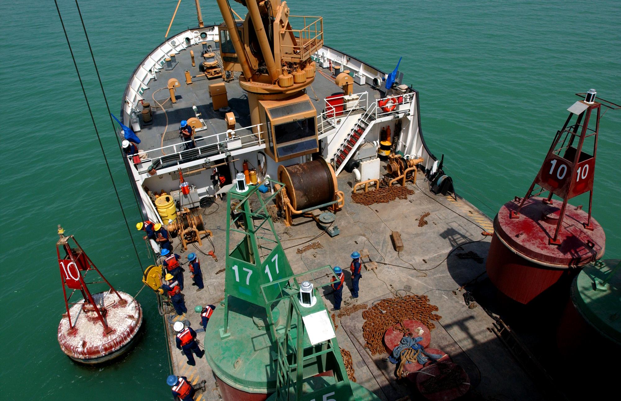 Members from the Coast Guard Cutter Walnut perform buoy deck operations in the Persian Gulf. The cutter arrived in the Persian Gulf Feb. 27, 2003, to support U.S. Naval Forces Central Command during Operation Iraqi Freedom.  (Coast Guard Collection)