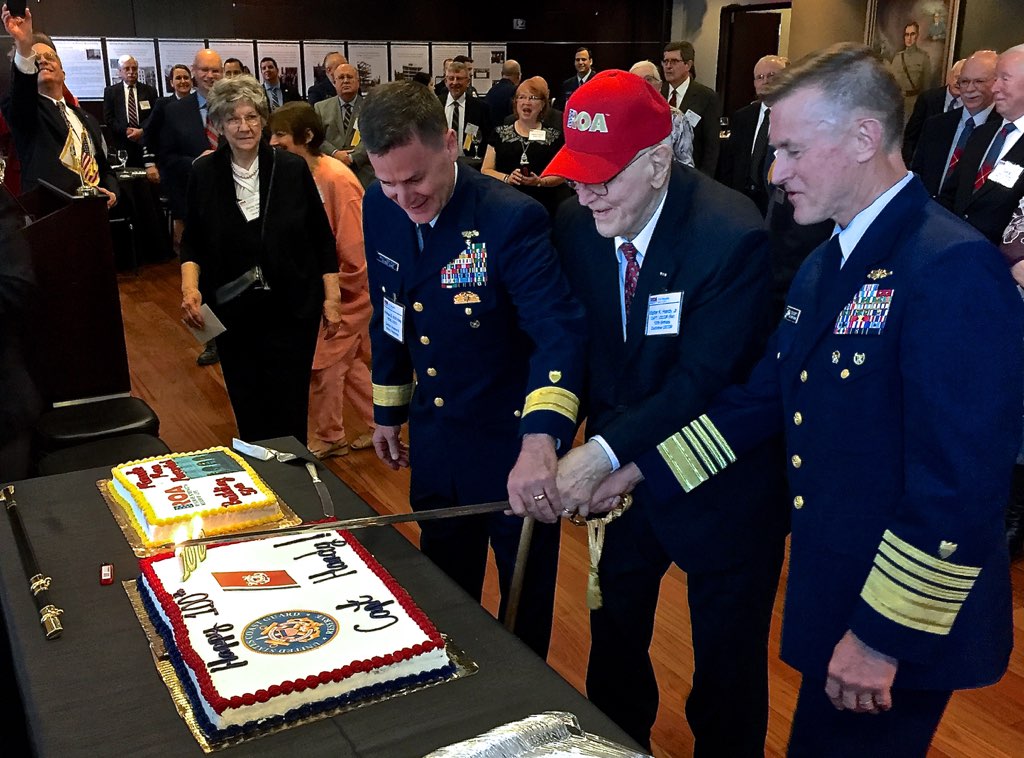 The Coast Guard and Reserve Organization of America celebrate Capt. Walter Handy’s 100th birthday in 2017. Pictured is Handy flanked by former Rear. Adm., Scott McKinley (left), and former Coast Guard Commandant Paul Zukunft (right). (Coast Guard photograph)