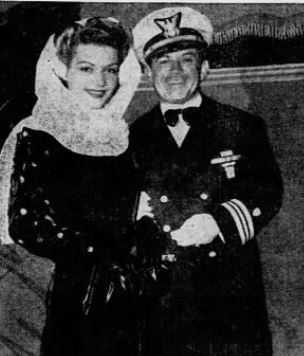 Newspaper photograph showing Lt. Cmdr. Henry Garcia in his dress blue uniform with Hollywood starlet Mary Moore. (Los Angeles Times)