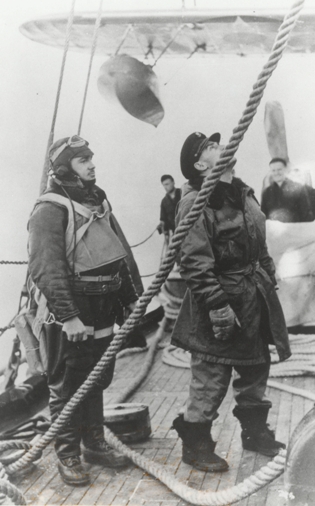 4.	Lt. John Pritchard on the deck of the Northland awaiting deployment of the Grumman “Duck” amphibian aircraft from the cutter. (U.S. Coast Guard)