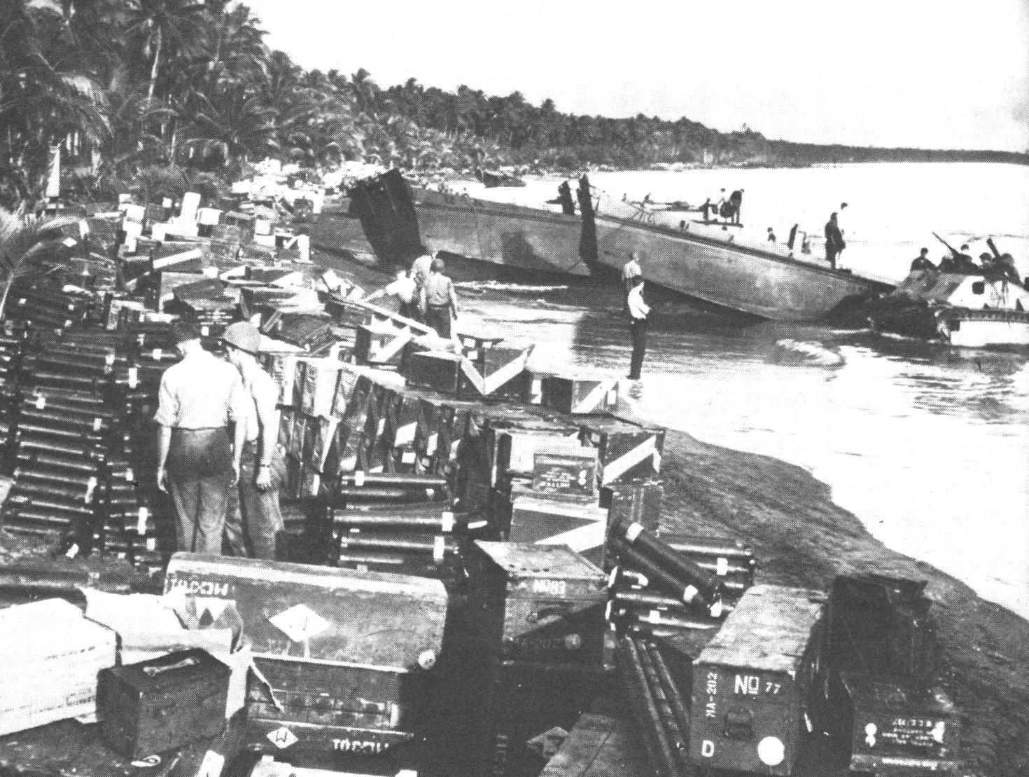 Supplies landed on the beach at Guadalcanal by landing craft, August 1942. Coast Guardsmen and watercraft kept critically needed supplies flowing to the 1st Marine Division fighting in the jungles of Guadalcanal. (Courtesy of the U.S. Navy)