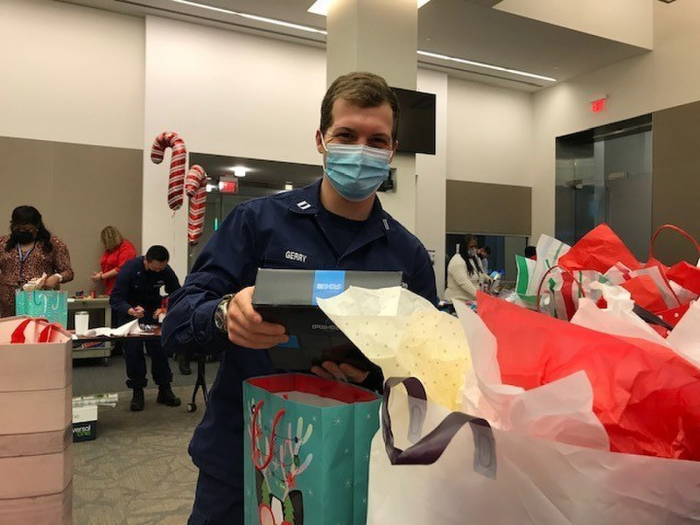 Members of Headquarters, Base National Capital Region, and Department of Homeland Security gathered to pack gift bags and personal care item kits for communities neighboring the Douglas Munro Coast Guard Headquarters, in Washington, D.C., Dec. 16, 2020. Donated items were distributed through partners in the District of Columbia Housing Authority Ward 8 community and to the So That Others Might Eat (SOME) non-profit. An annual event at Base NCR, the holiday gift drive is one of two volunteer events, followed by a back-pack school supply drive that takes place each summer. Numerous volunteers sorted, packed and loaded the items for distribution. (U.S. Coast Guard Photo)