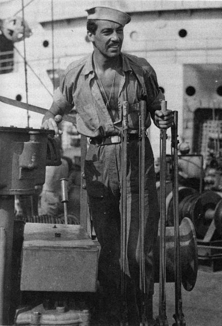 Cesar Romero at the controls of Cavalier’s ship’s crane. (Coast Guard Collection)