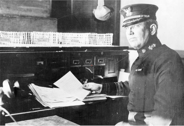 Capt. Godfrey Carden, Coast Guard Captain of the Port seated in his New York office during World War I. (U.S. Coast Guard)