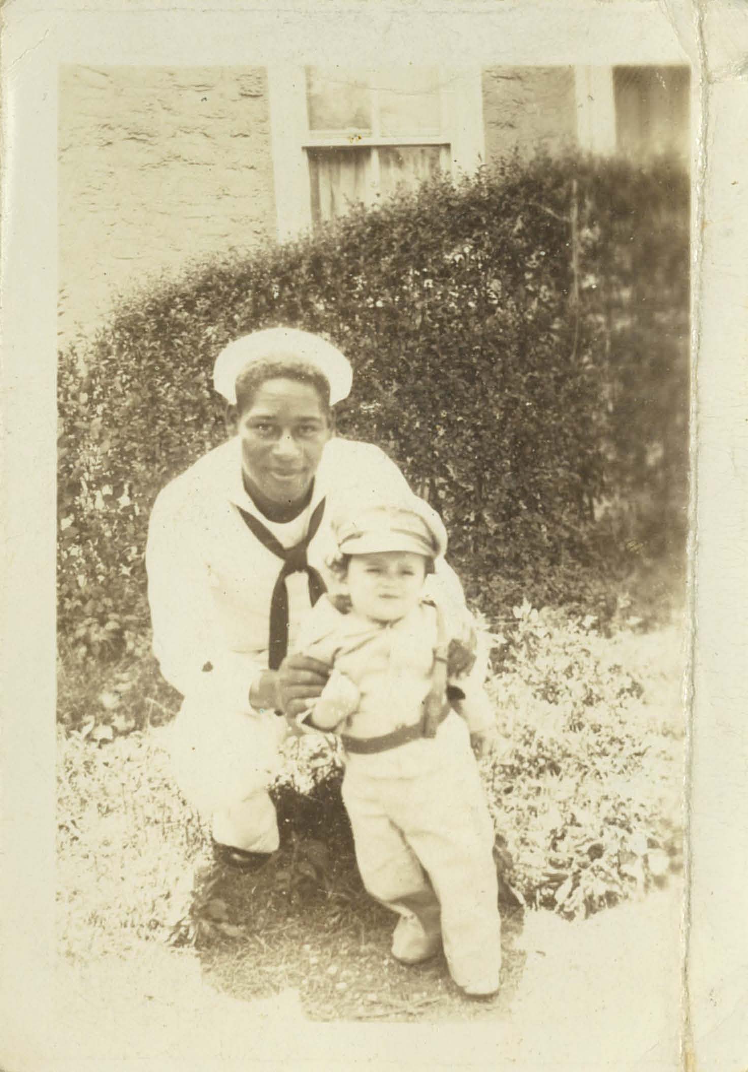 5.	A family photo of Coast Guardsman Emlen Tunnell in dress whites with his niece Catherine Robinson. (Courtesy of Tunnell family)