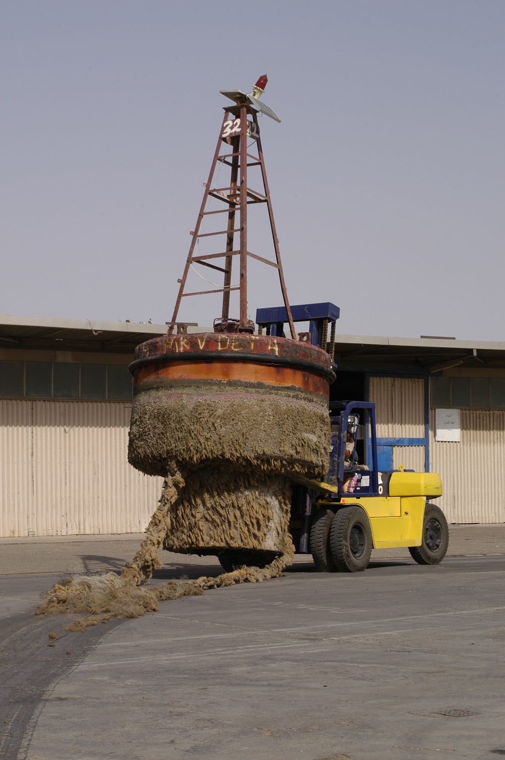 Aged Iraqi buoy shows marine growth encrustation and dilapidated upper works. (Coast Guard Collection)