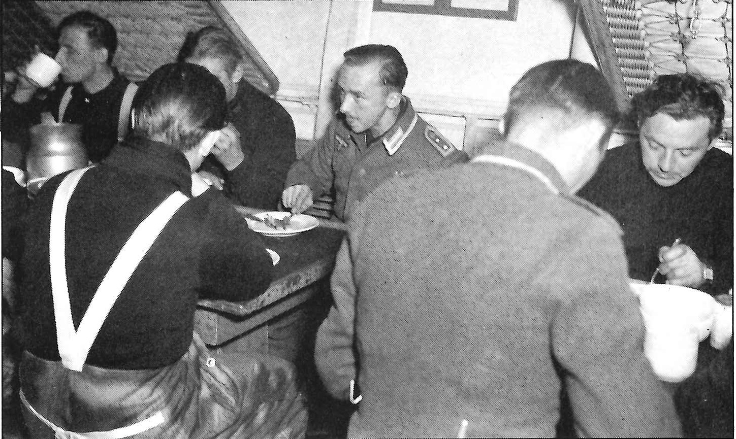 5.	Captured Nazi weather station crewmembers under armed guard on board the Northland. (U.S. Coast Guard)